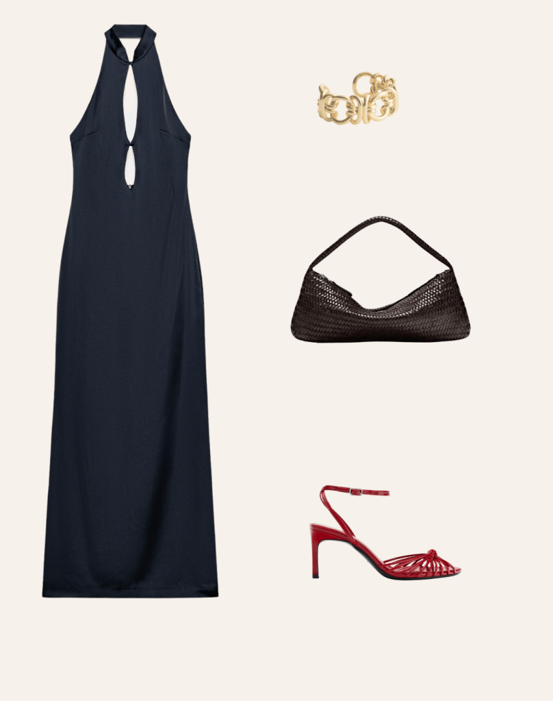 A navy satin dress styled with red strappy sandals and a woven bag an easy evening outfit idea.